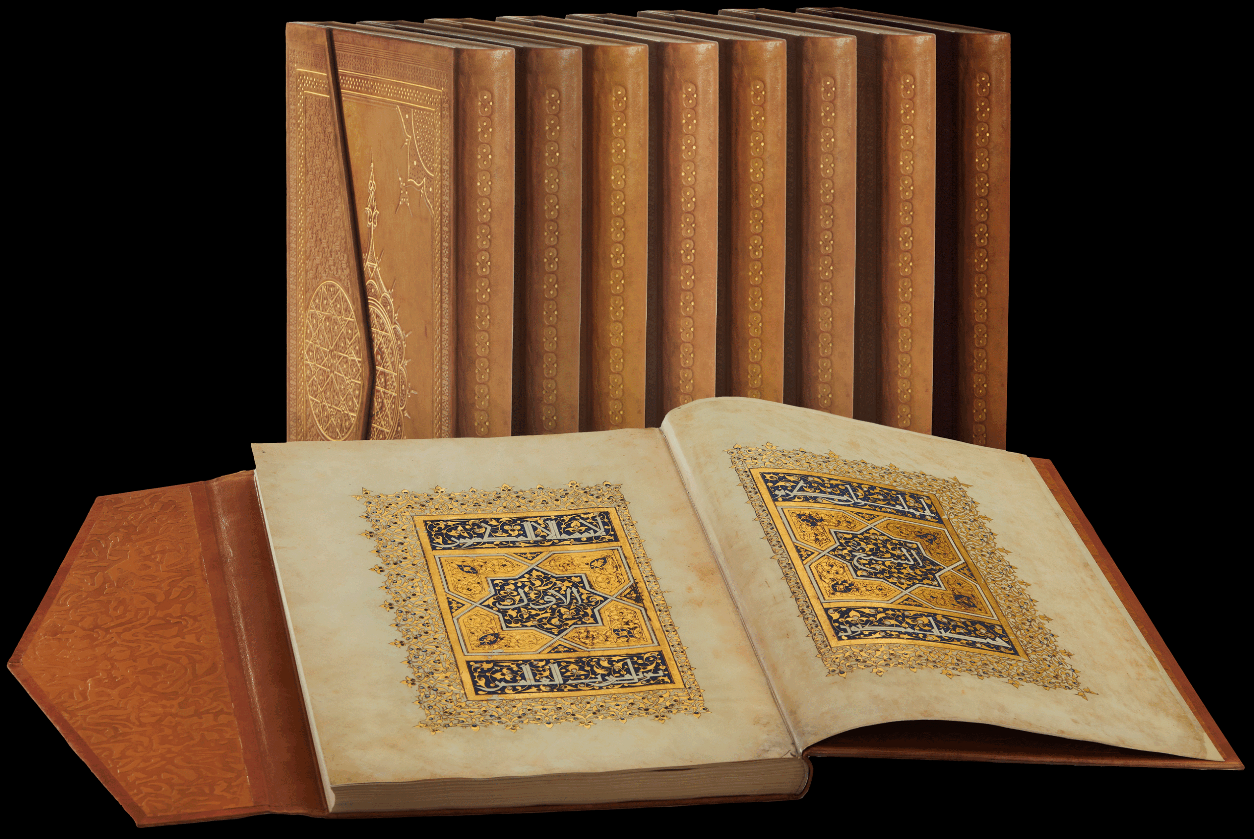 The seven volumes of the Baybars Qur’an facsimile edition. The eighth volume is the extensive Commentary Volume. The open volume displays the frontispiece to volume one. <small><a href="https://www.facsimile-editions.com/copyright/">Image © Copyright 2022 Facsimile Editions Ltd</a></small>